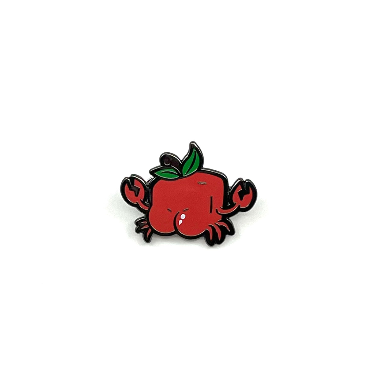 Pin with a design of a red crab with a butt on a white background